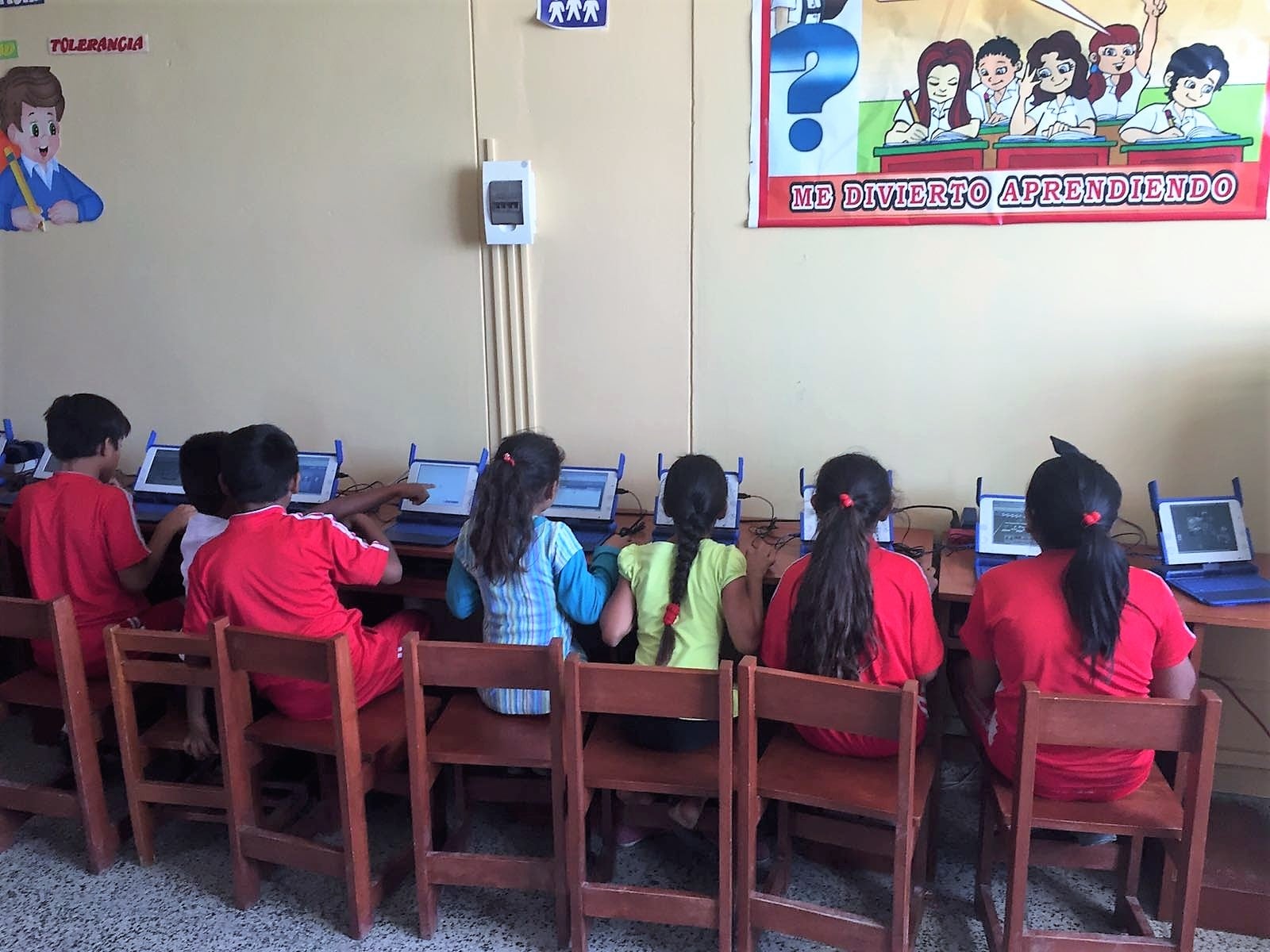 kids at school in Latin America with internet access and computers having fun learning