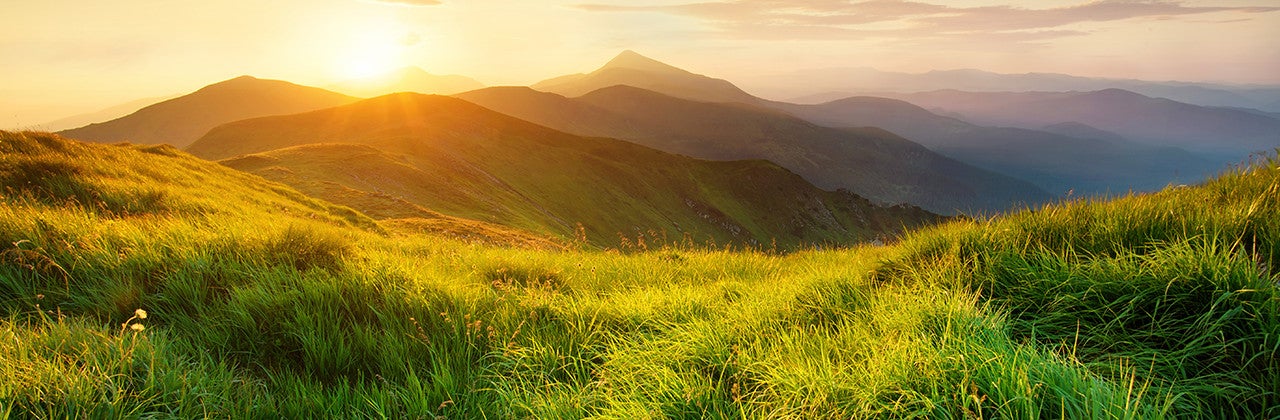 Banner image of a mountains landscape at the sunset