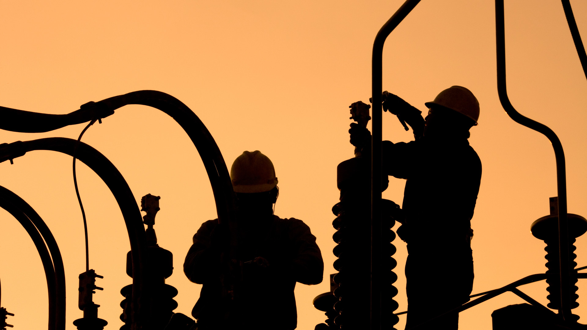 Energy plant workers at dawn