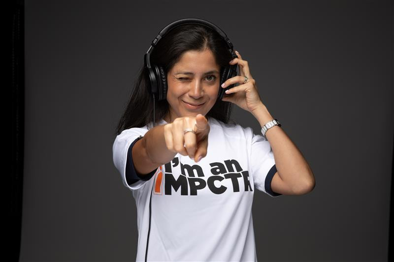 IMPCT wearing headphones at work