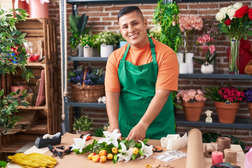 Image of an hispanic worker at a flower store