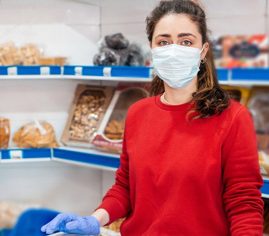woman in bakery with mask