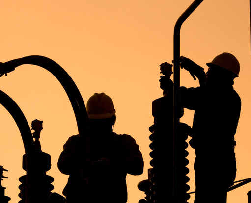 Energy plant workers at dawn
