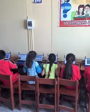 kids at school in Latin America  with internet access and computers having fun learning