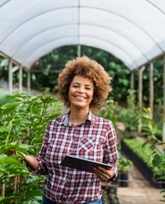 Image of an african-american woman in a greenhouse