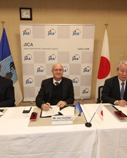 three men at a signing