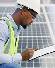 man installing solar panels