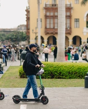 People riding scooters in downtown Lima