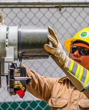 Man working on electric meter