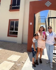Family in front of apartment building