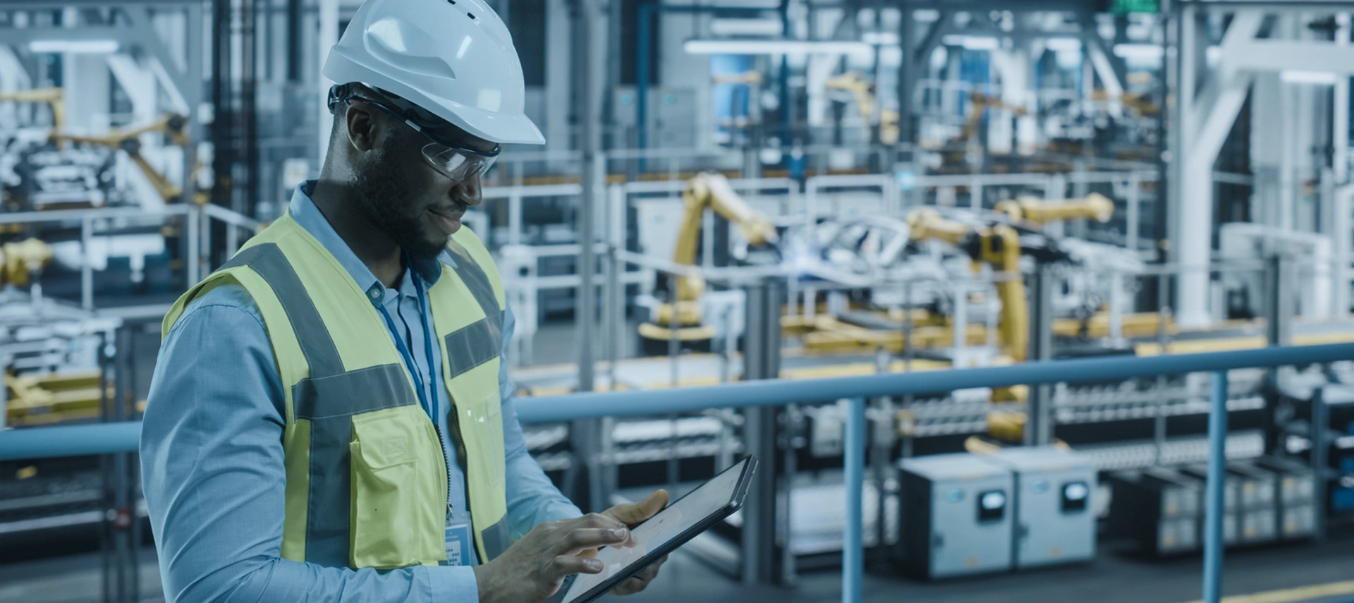 Banner image showing a factory worker wearing helmet. 