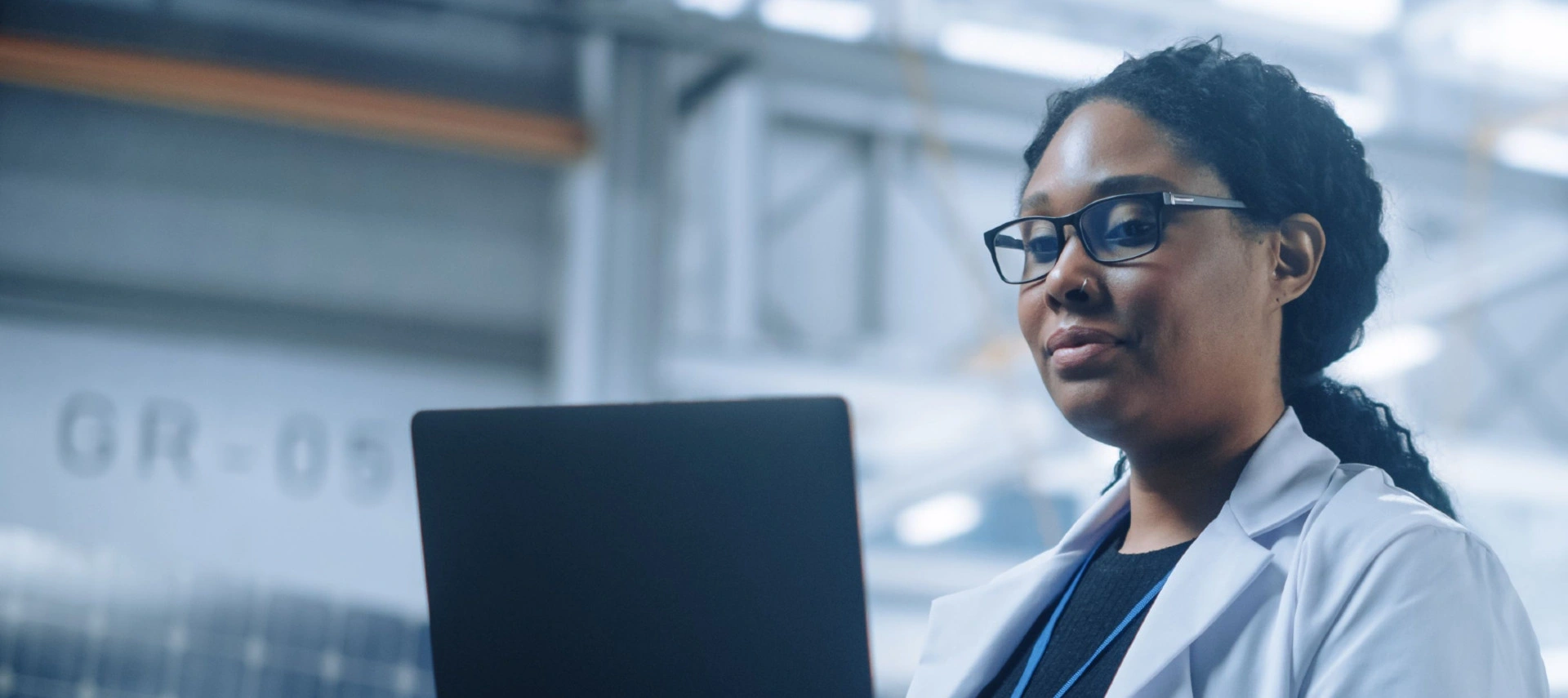 Image of an african american female scientist working on her computer