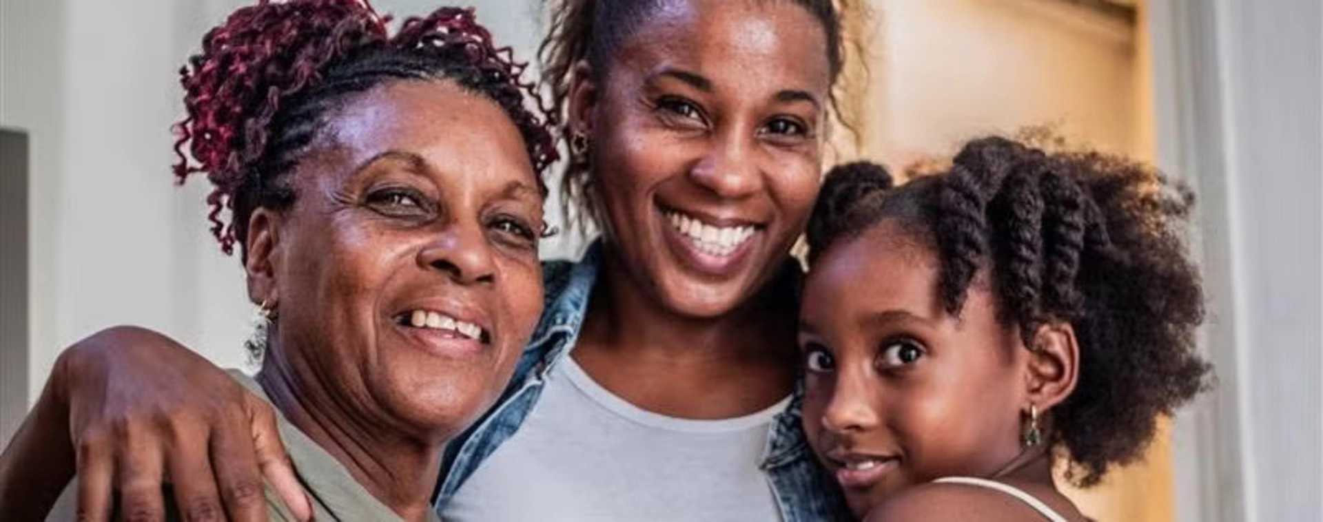 Banner image of an african-american family smiling