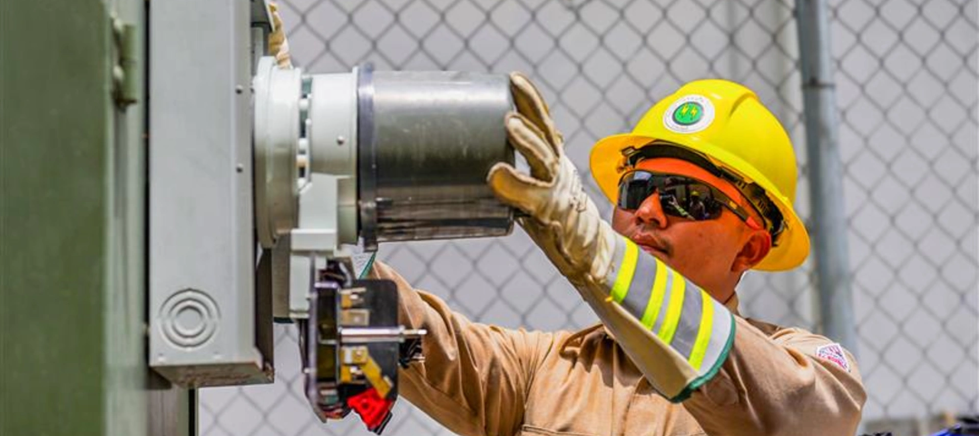 Man working on electric meter