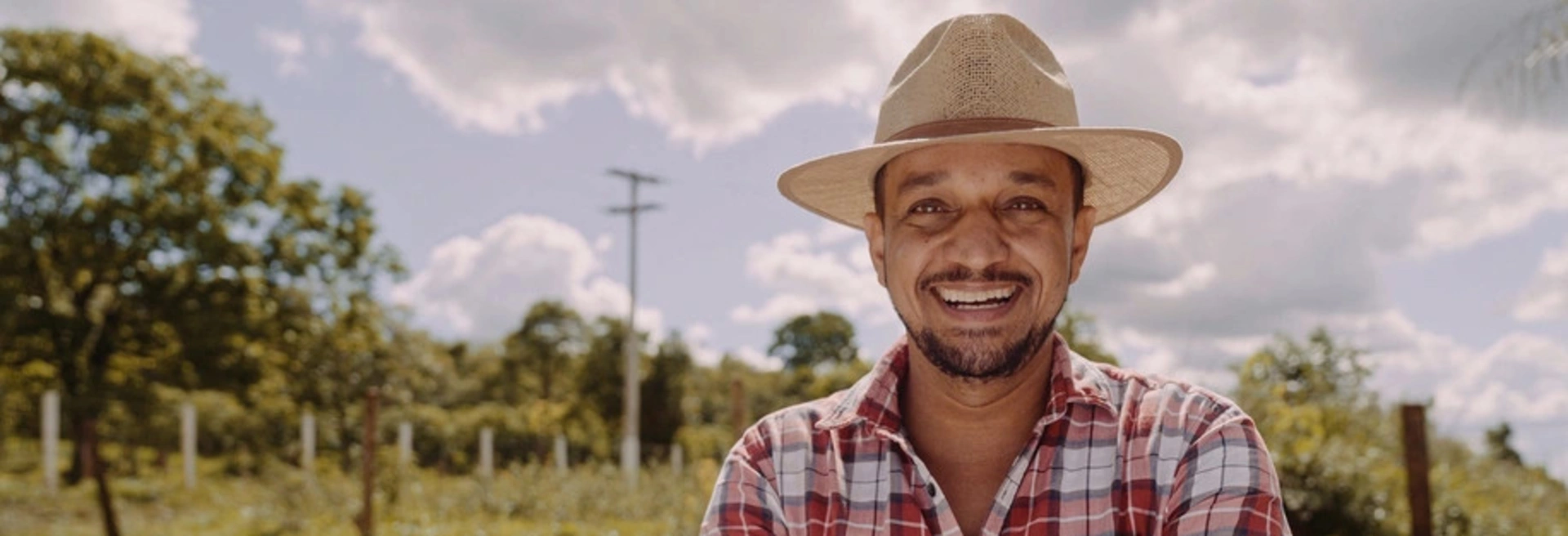 Banner image of a farmer smiling
