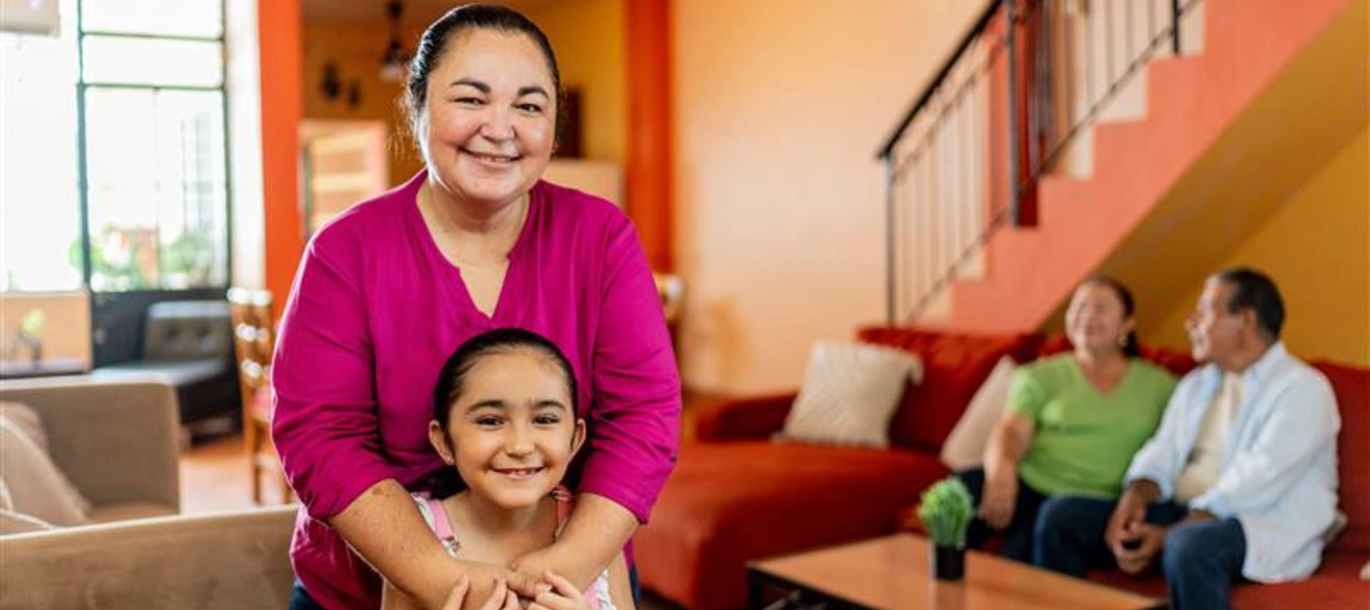 Image of a happy Mexican family at their new house.