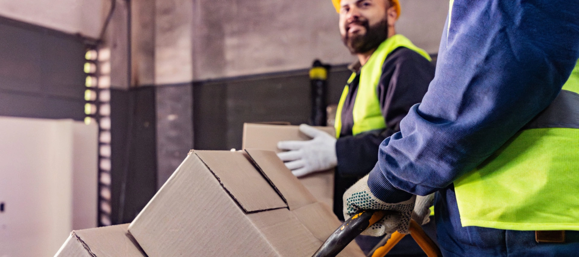 Image showing two workers at the warehouse of a packaging company
