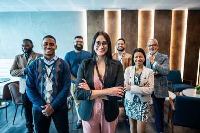 A group on seven people, women and men apparently part of the board of a company.