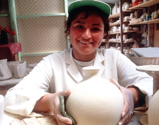 Female microentrepreneur working in ceramic store