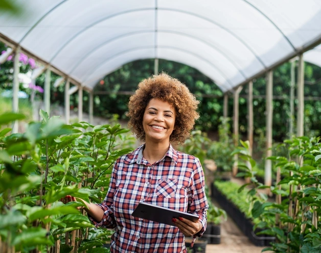 Image of an african-american woman in a greenhouse