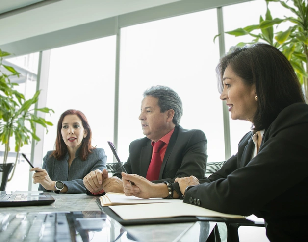 A business meeting of two women and a man