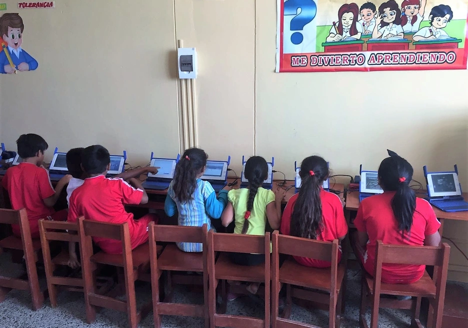 kids at school in Latin America  with internet access and computers having fun learning