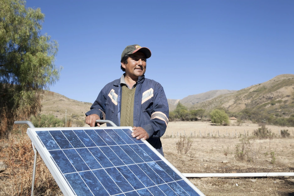 Man installing solar panels
