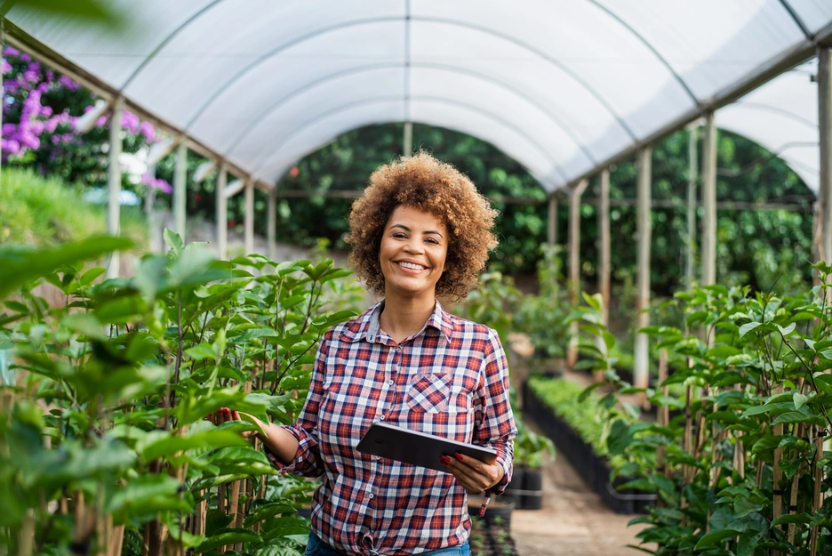 Image of an african-american woman in a greenhouse