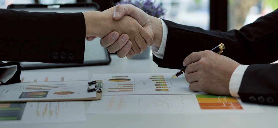 Image of two business men shaking hands
