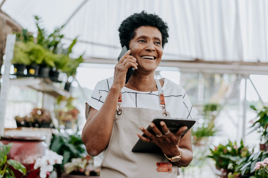 Image of a caribbean woman who runs a plants small business