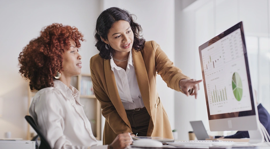 two women in banking looking at financial statements
