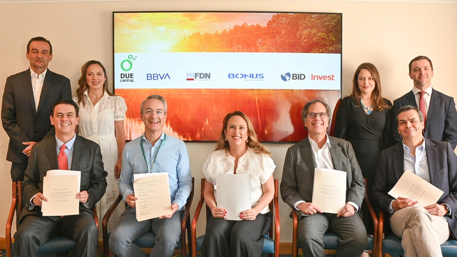 people in a signing ceremony