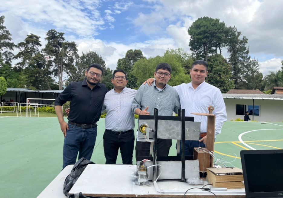 students smiling on a sports field