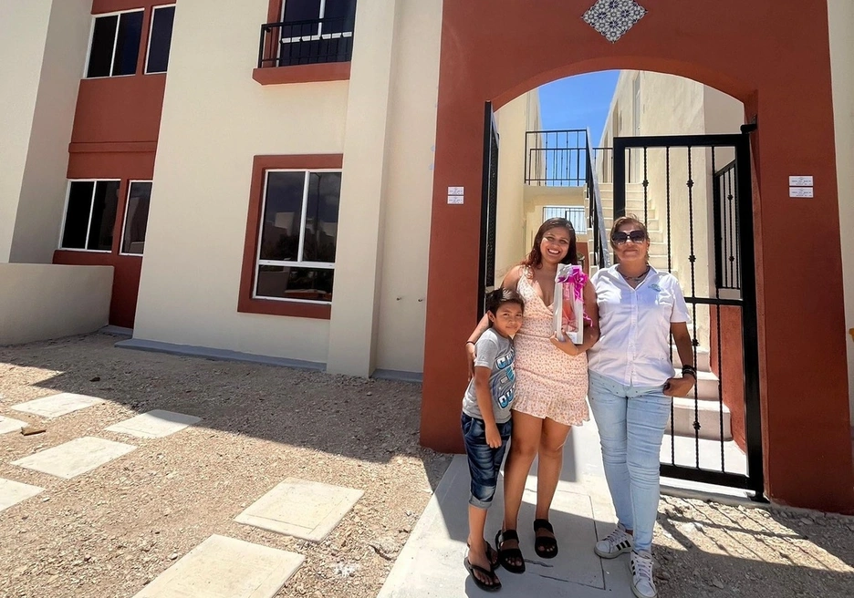 Family in front of apartment building