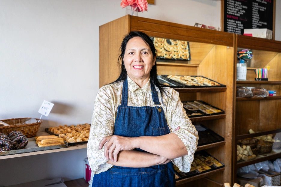 Image of an smiling woman at her bakery